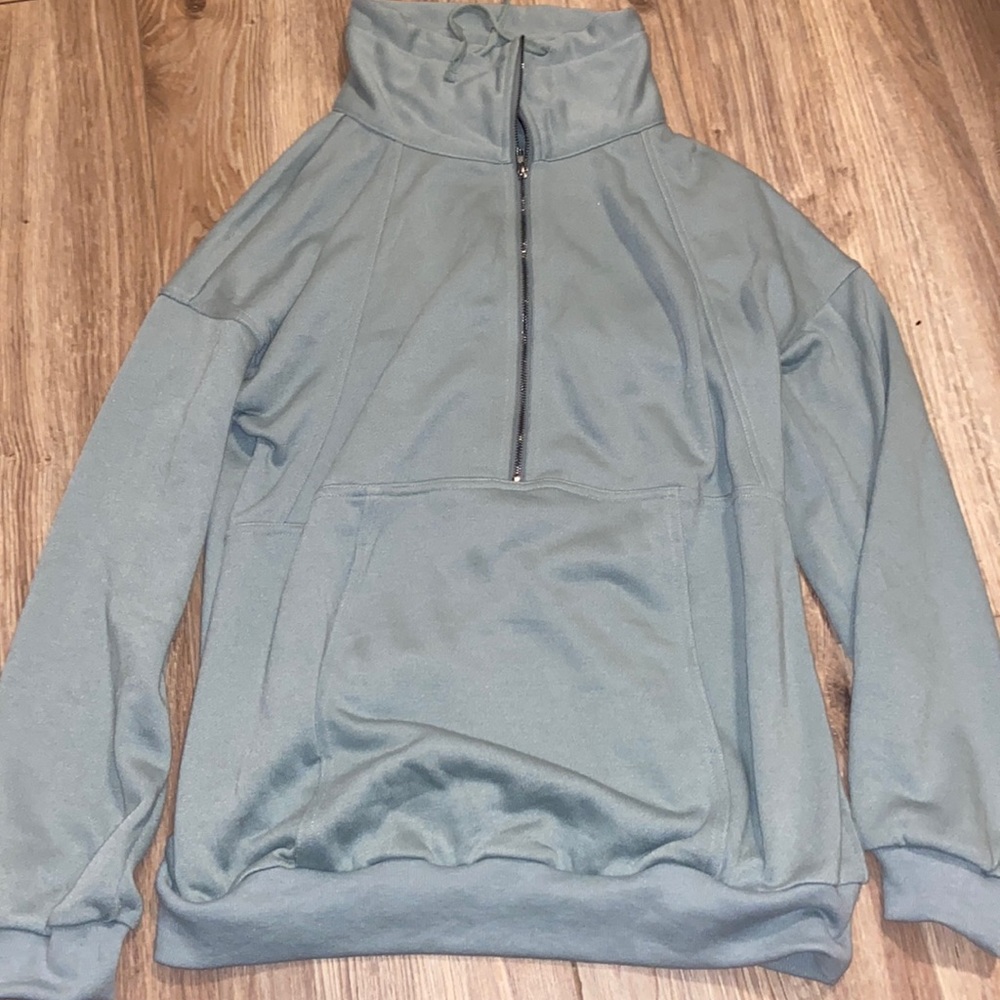 Sage green half zip. Worn a few times. Oversized.